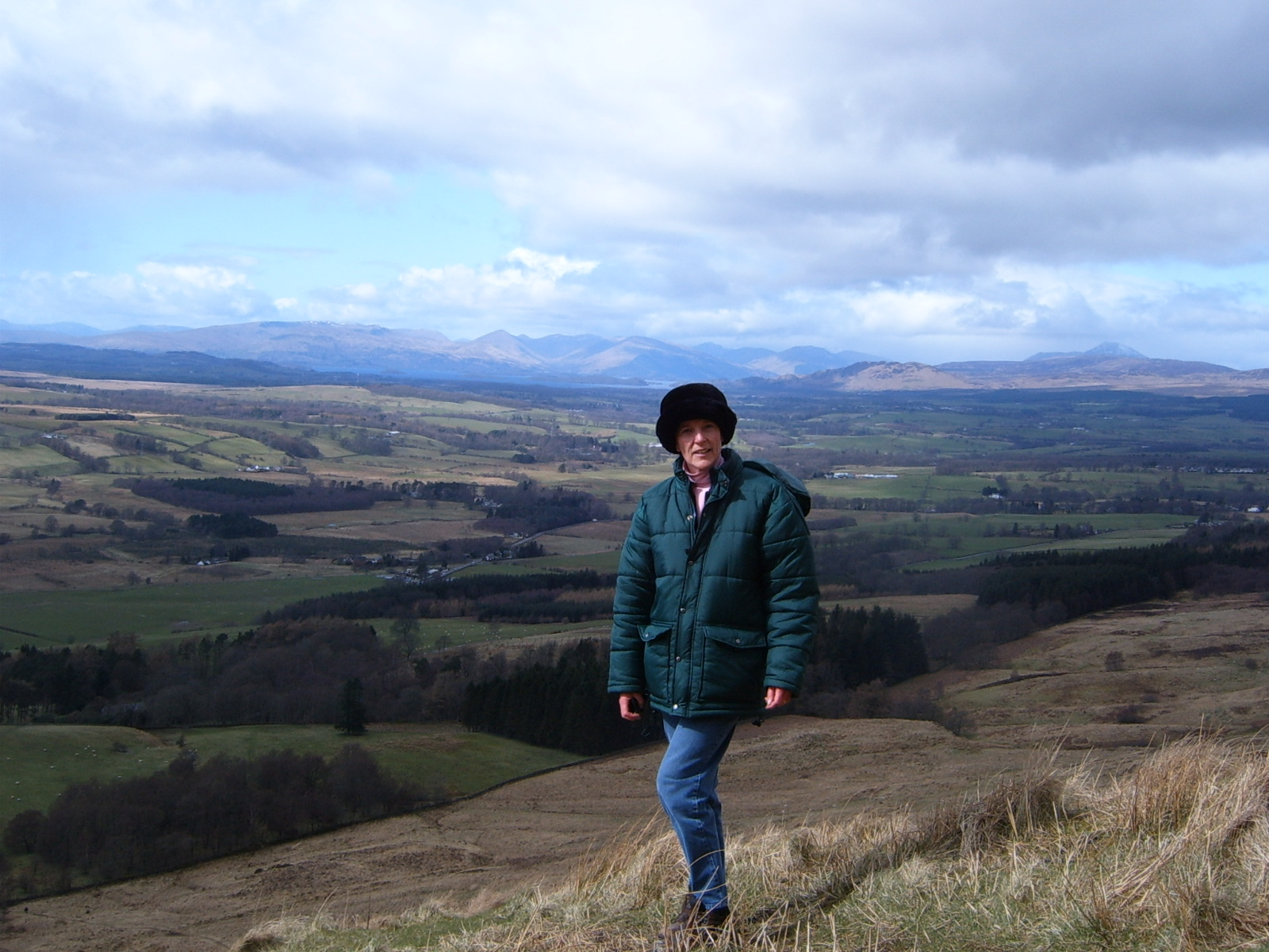 Photo of Helen with panoramic view of Loch Lomond.